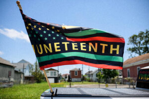 A flag with the word juneteenth written on it.